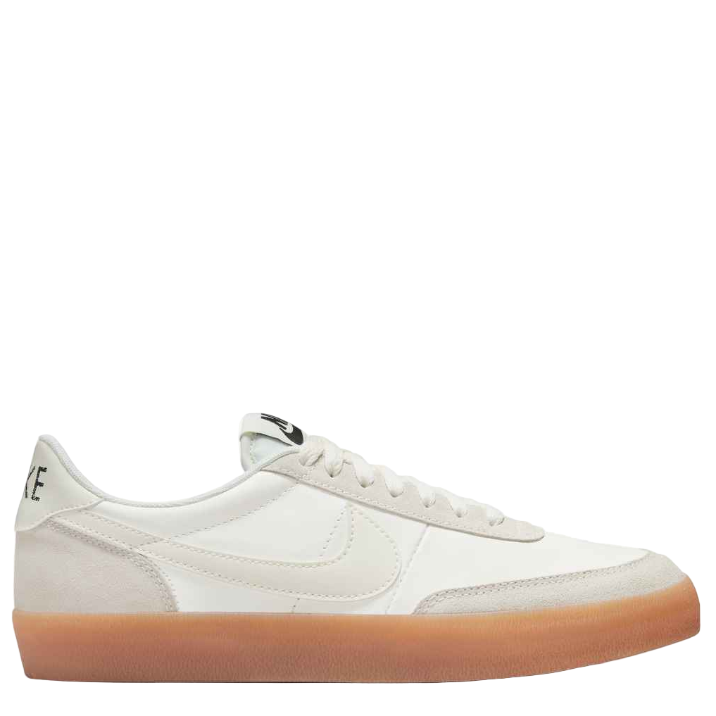 White sneaker with a brown sole on a white background