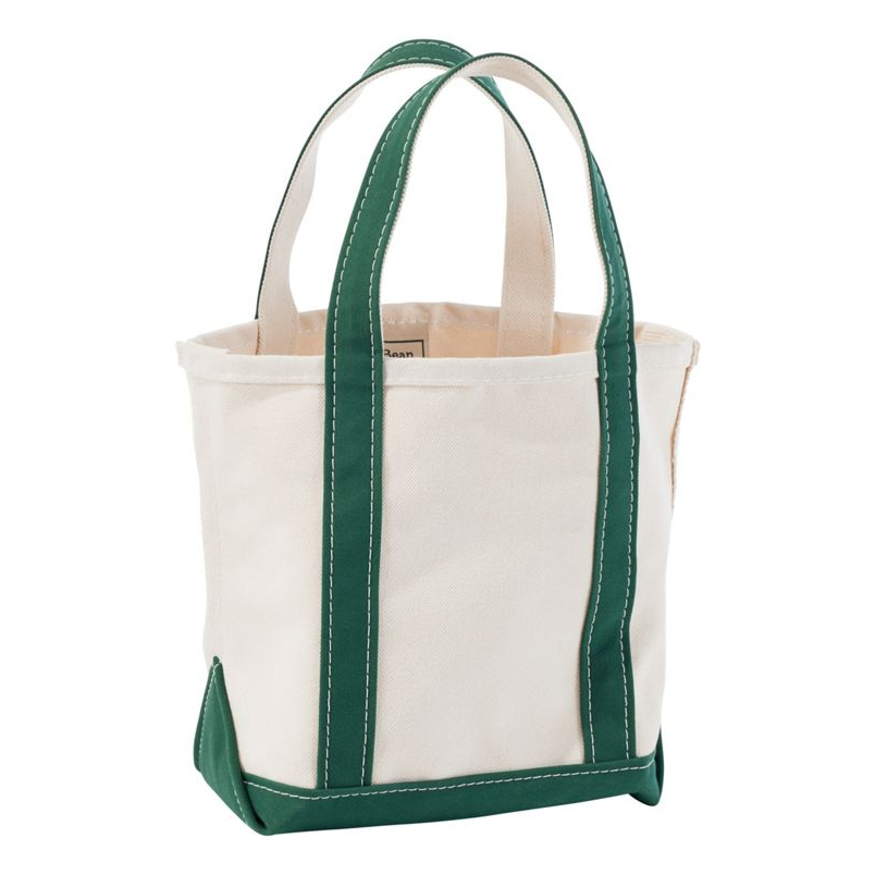 White tote bag with green handles and trim on a white background