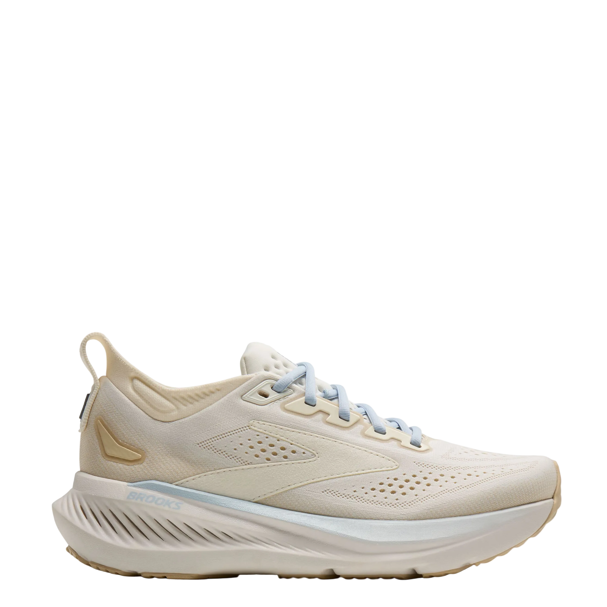 Beige running shoe with a white sole on a light gray background
