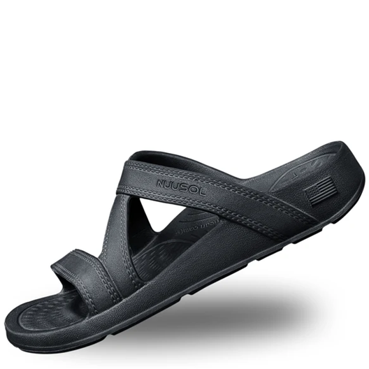 Black sandal with 'Muk Luks' branding on a white background