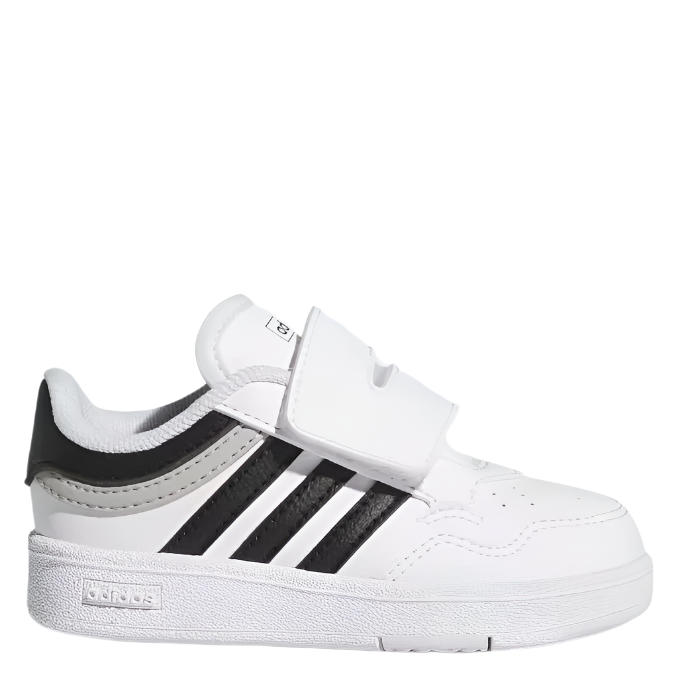 A white toddler's sneaker with black accents and a hook-and-loop closure strap.