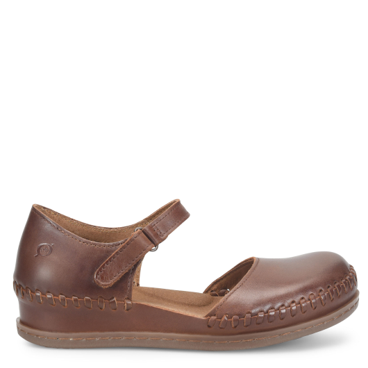 Brown leather shoe with a strap on a white background