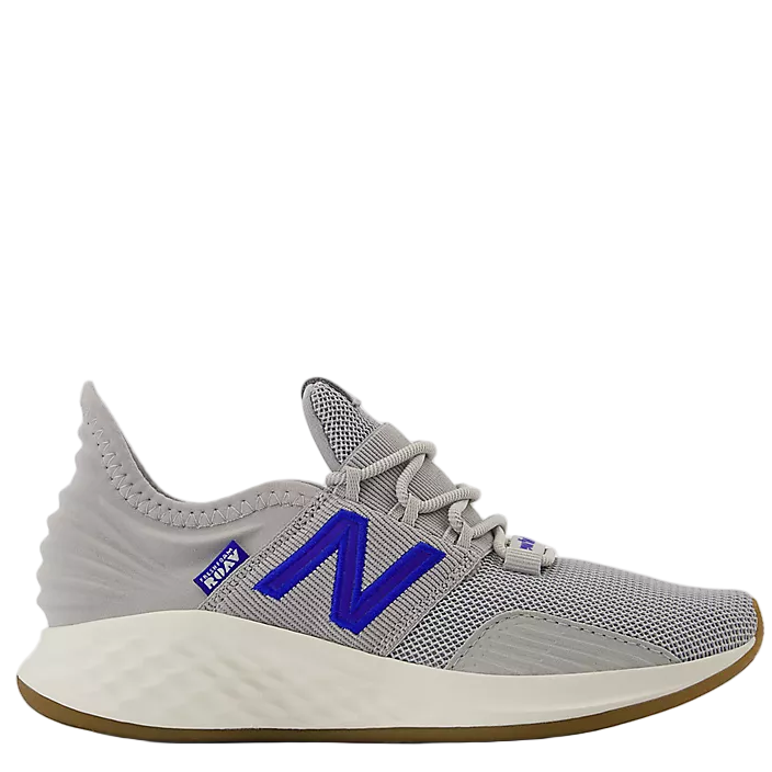 Gray athletic shoe with blue 'N' logo on a white background
