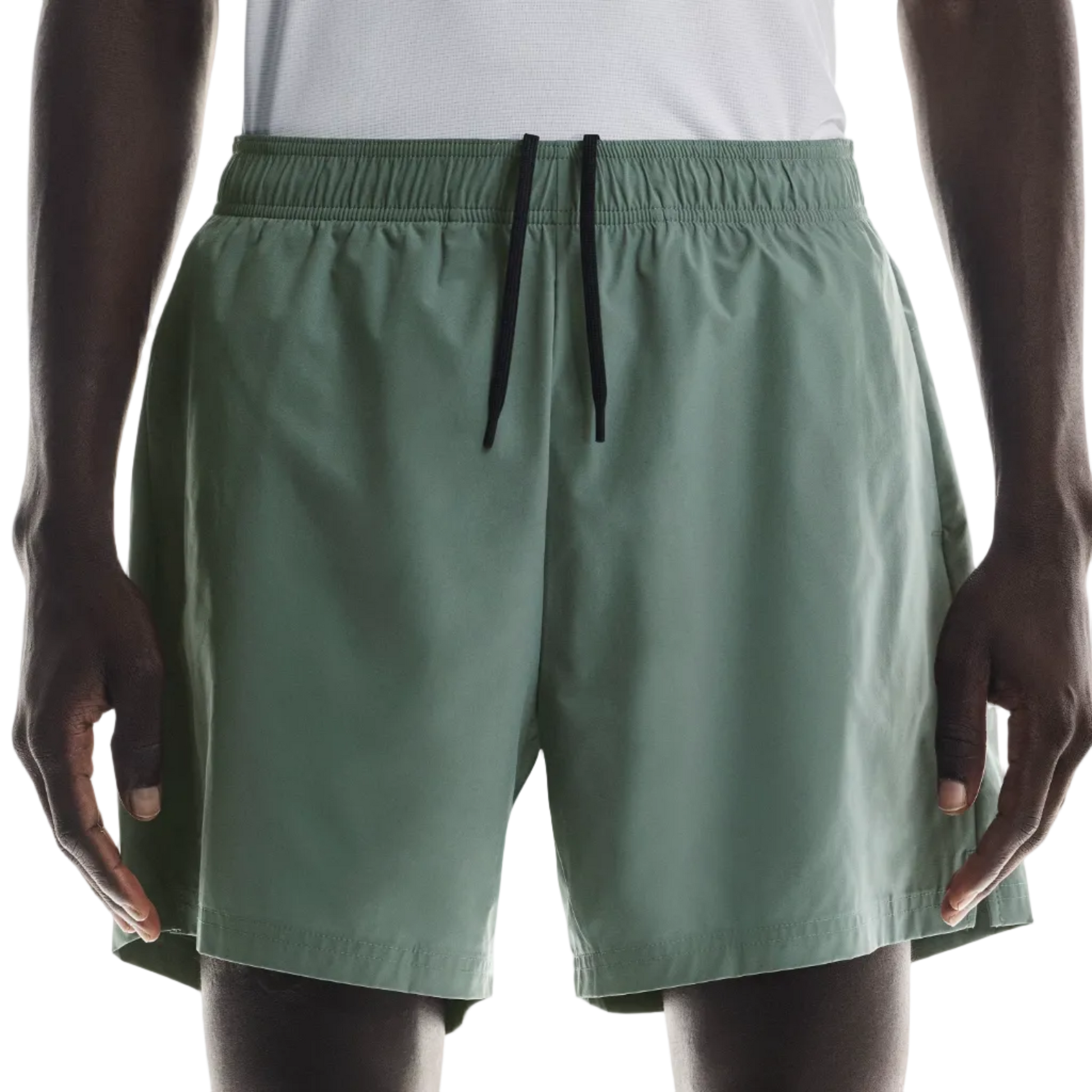 Person wearing green shorts on a white background