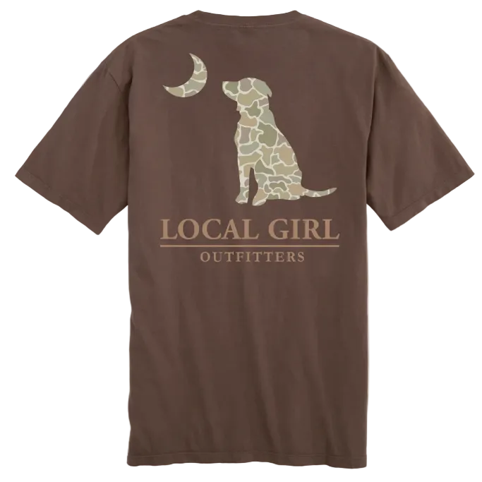 A brown short-sleeve t-shirt shown from the back, featuring a graphic of a dog silhouette filled with a camouflage pattern under a crescent moon, with the text 'LOCAL GIRL OUTFITTERS' printed below. A yellow 'NEW' badge is in the top-left corner.