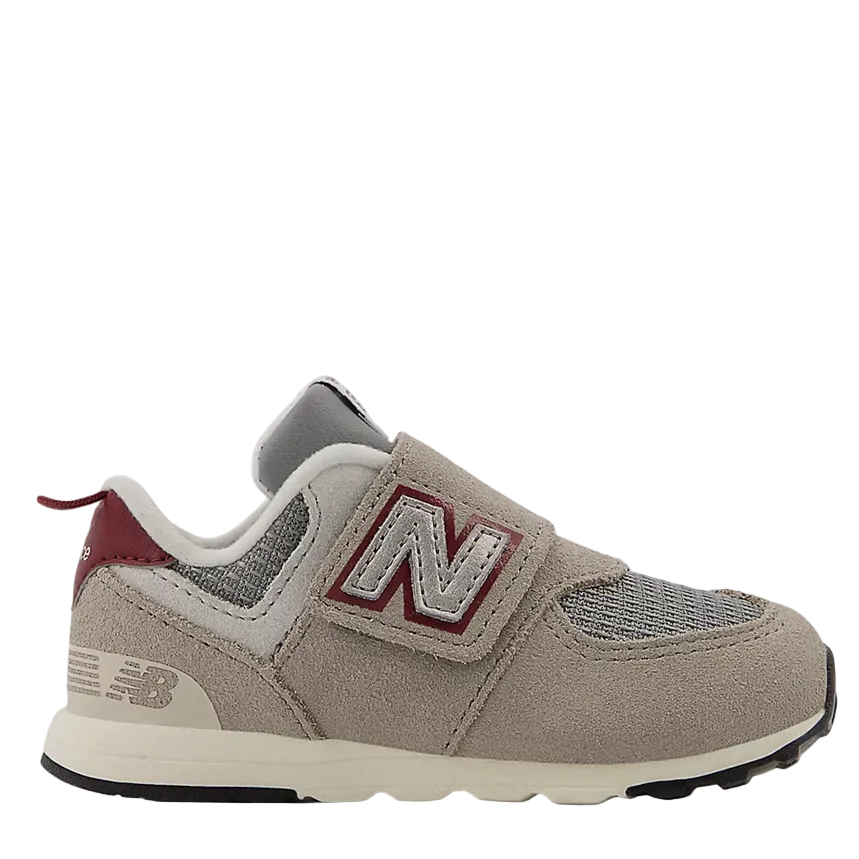 Gray sneaker with red accents on a white background