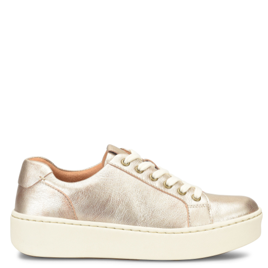 Gold sneaker with white sole on a white background
