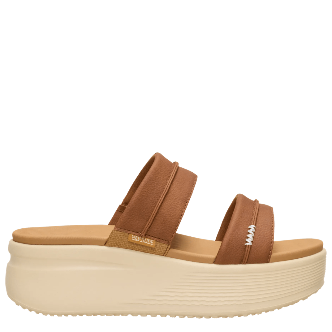 Brown sandal with a thick sole on a white background