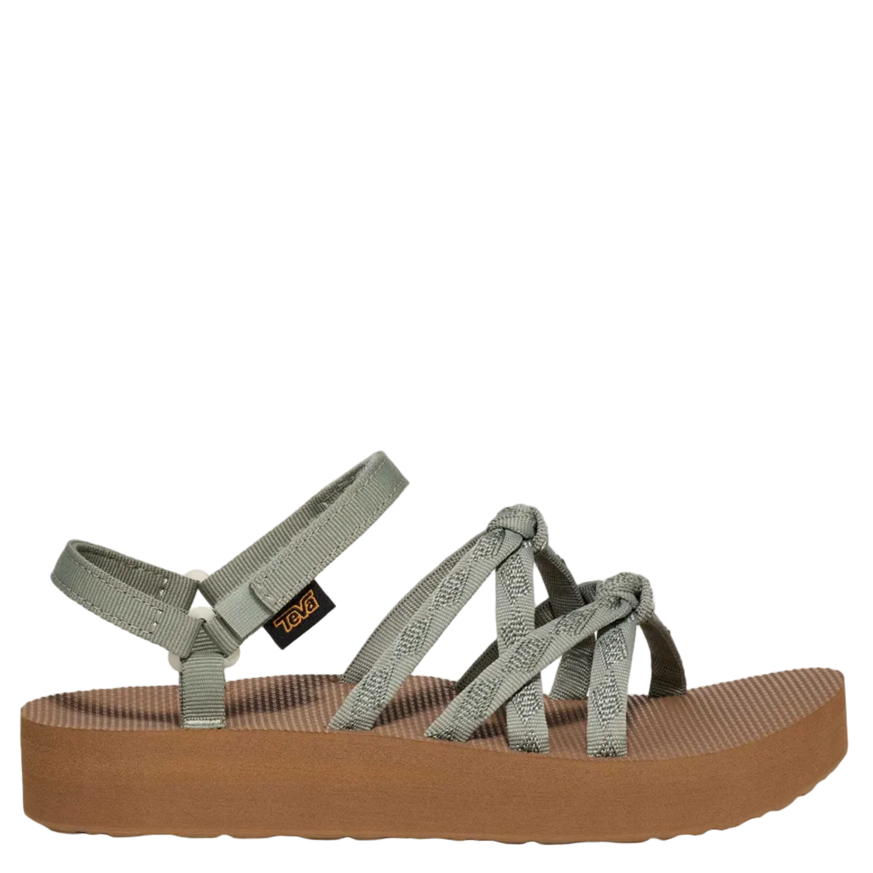 Green sandal with a brown sole on a white background