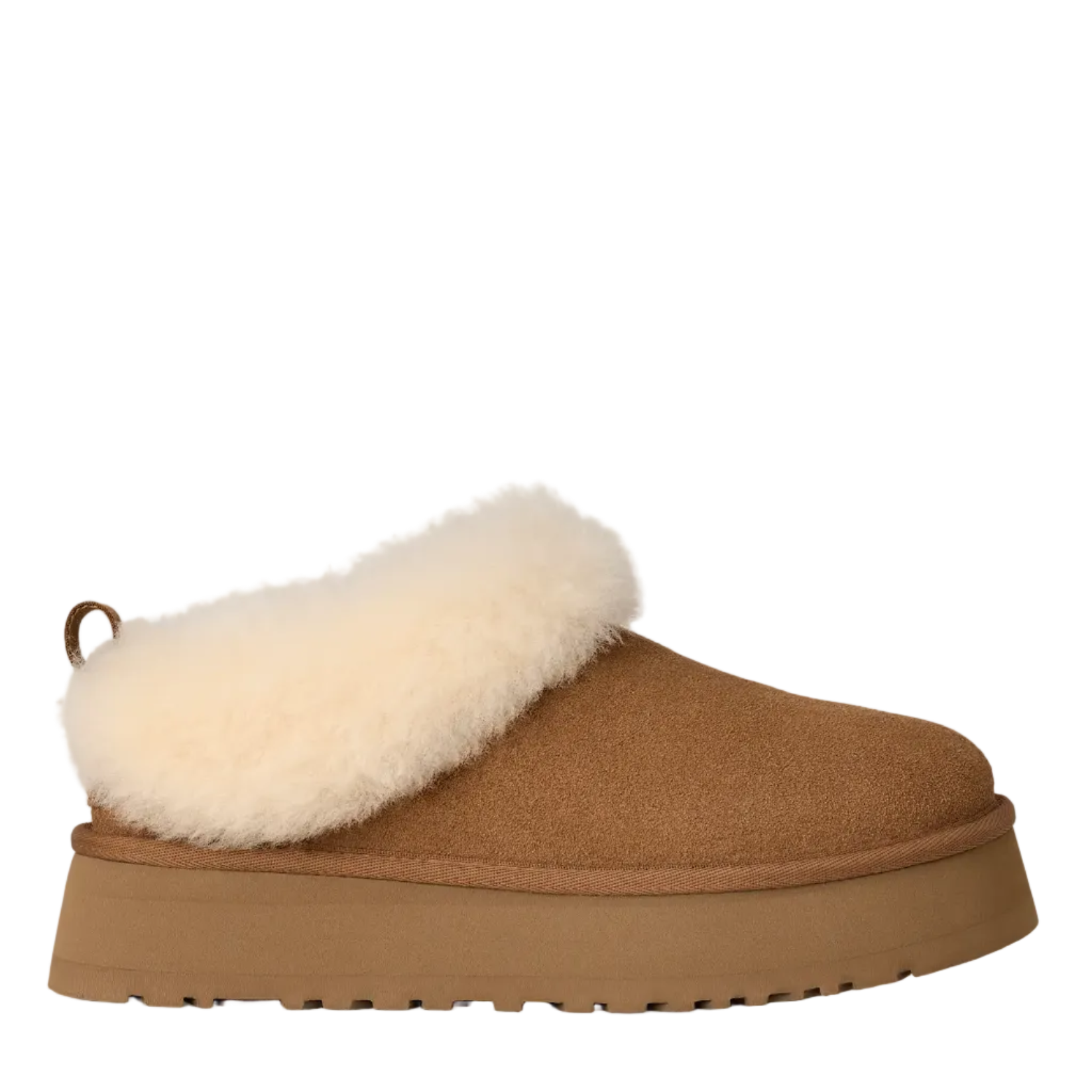 A single slip-on clog-style slipper in tan suede with a thick cream shearling collar and a matching tan platform sole, shown in side profile against a light off-white background.