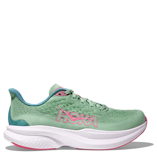 Green running shoe with pink accents on a white background