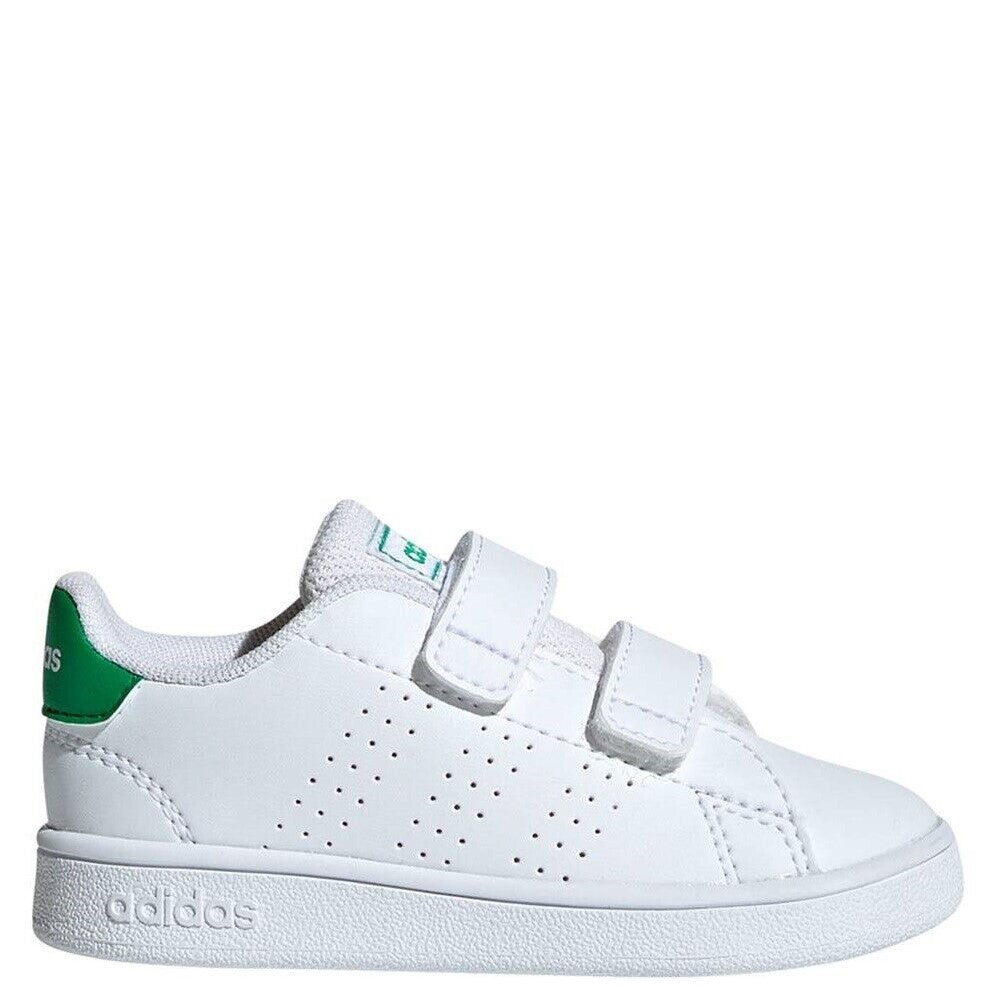 A pair of white adidas athletic shoes for toddlers with green accents and velcro straps.