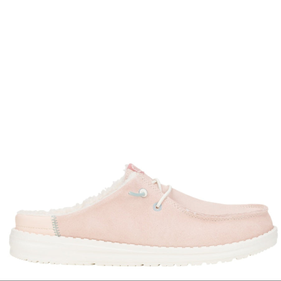 Pink slip-on shoe with white sole on a white background